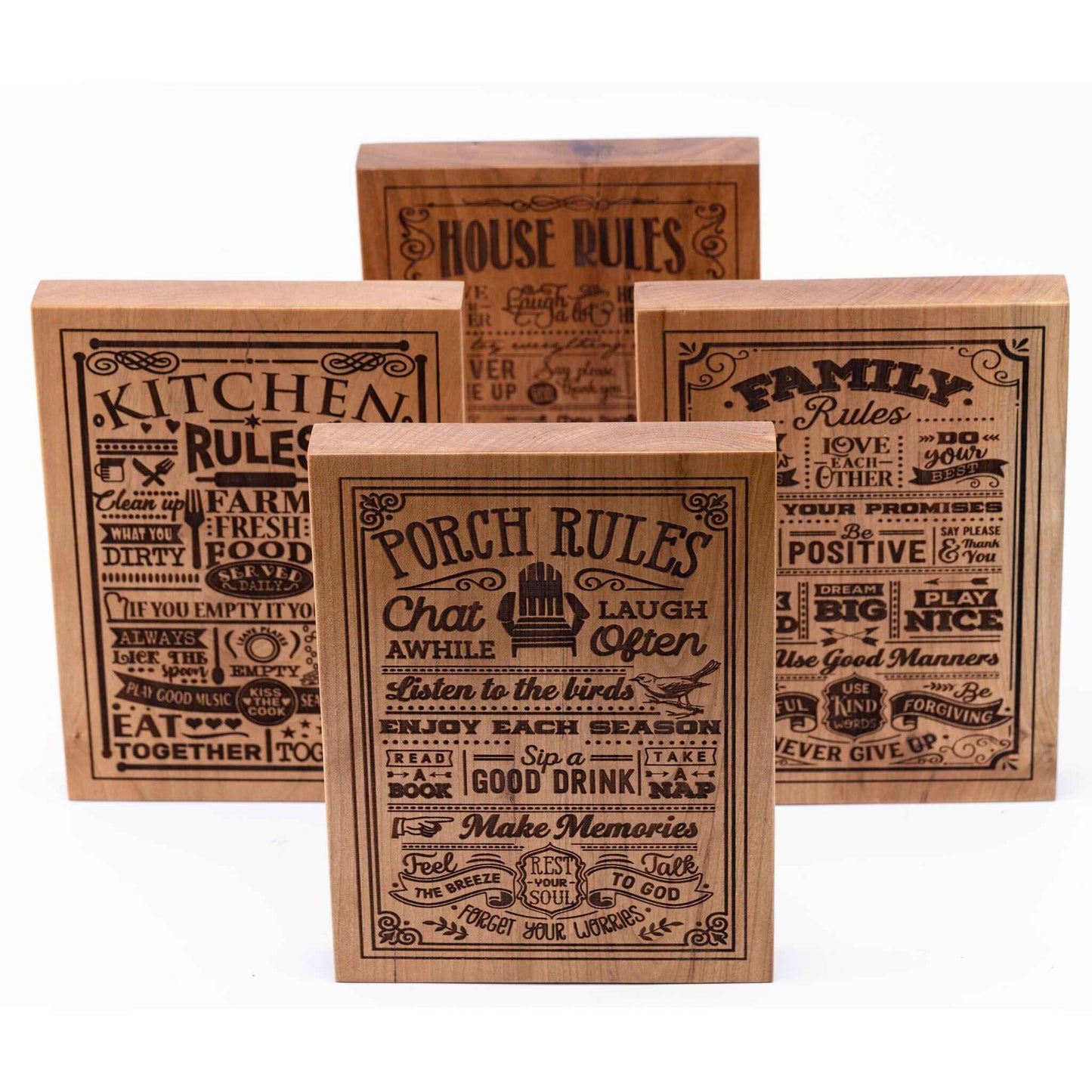 Four Plaques showing in Cherry woods - Porch Rules, Kitchen Rules, Family Rules, House Rules