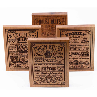 Four Plaques showing in Cherry woods - Porch Rules, Kitchen Rules, Family Rules, House Rules