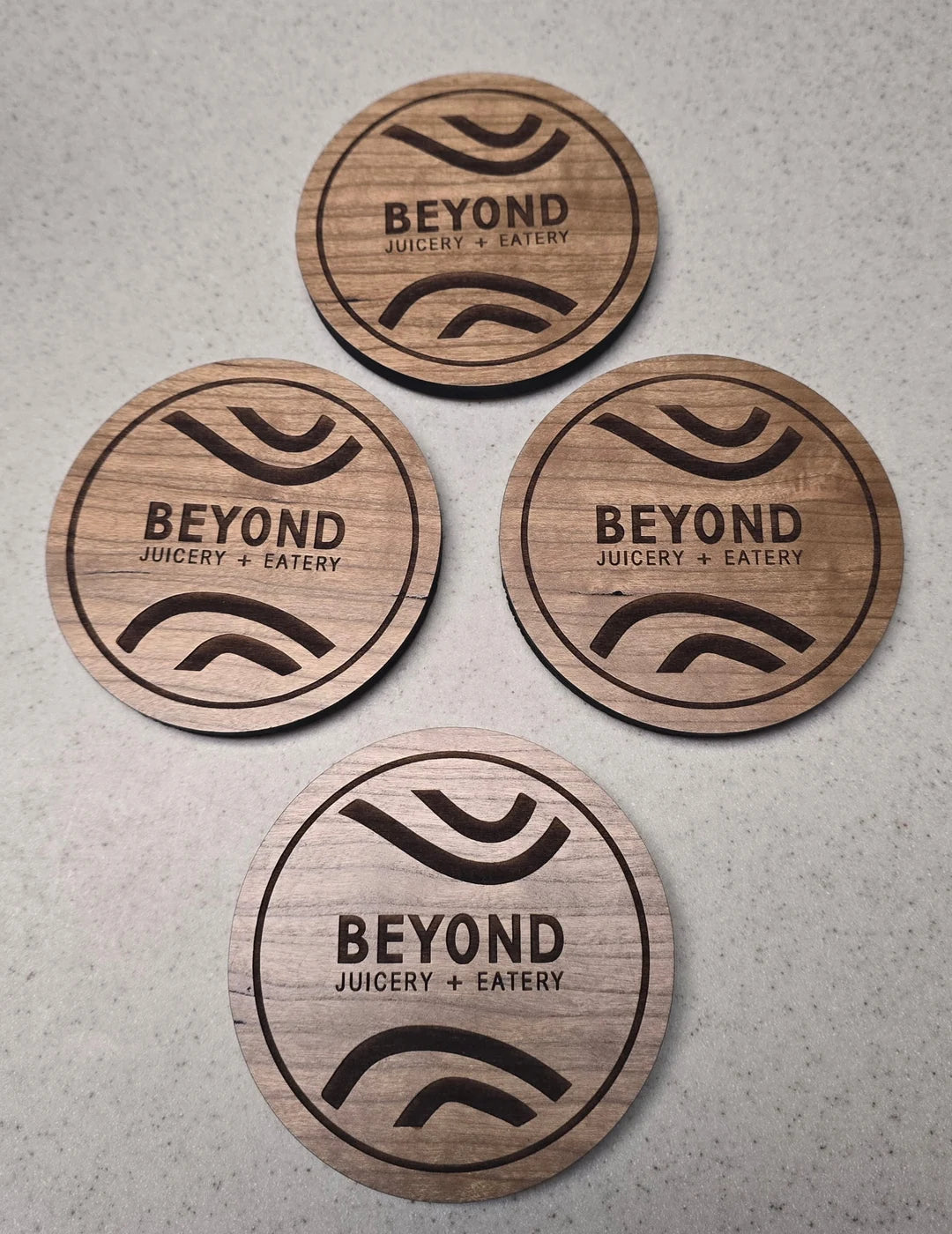 Coaster set engraved for Beyond Juicery + Eatery