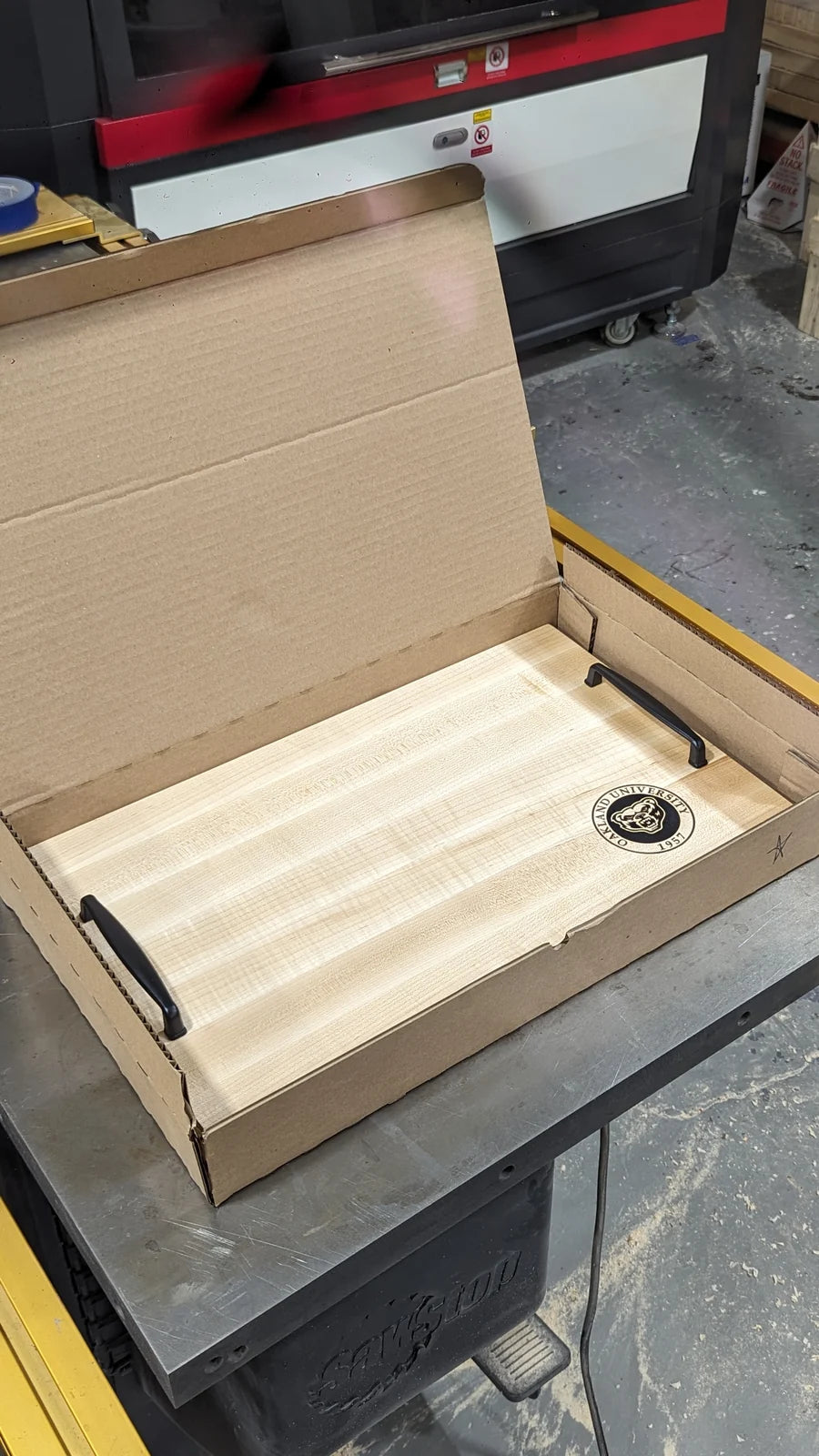 A finished engraved tray boxed and ready to ship.