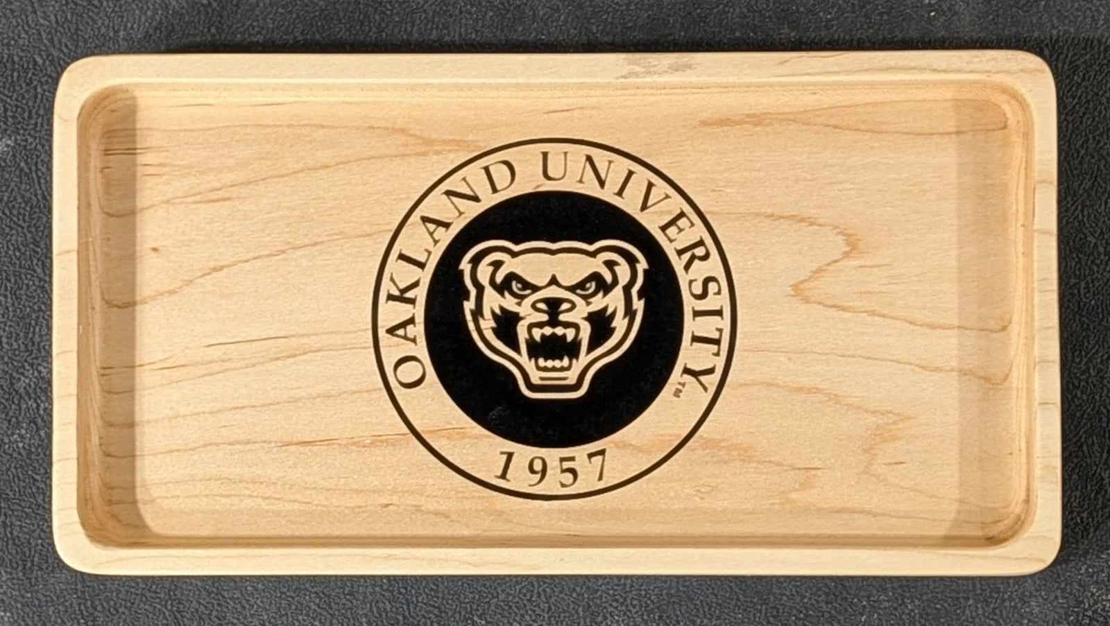 A maple tray engraved with the Oakland University Golden Grizzly seal.