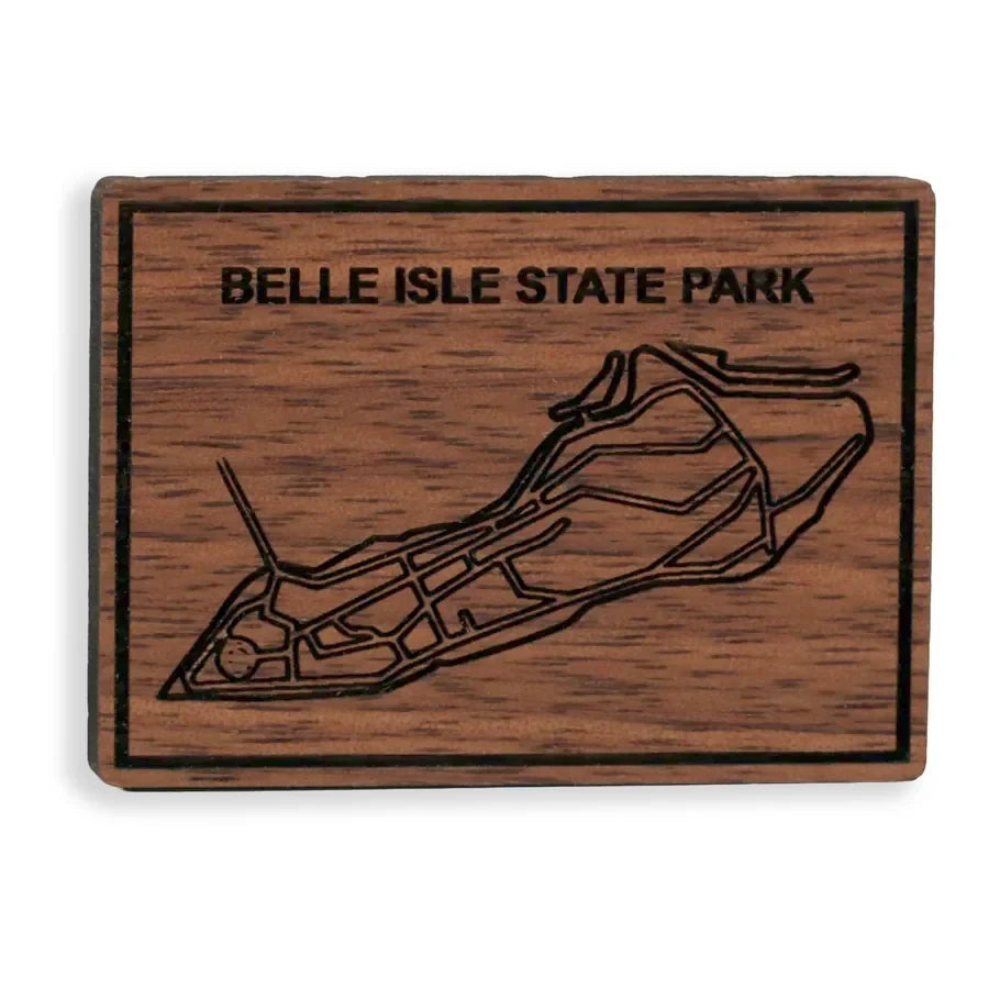 A walnut magnet engraved with a map of Belle Isle.